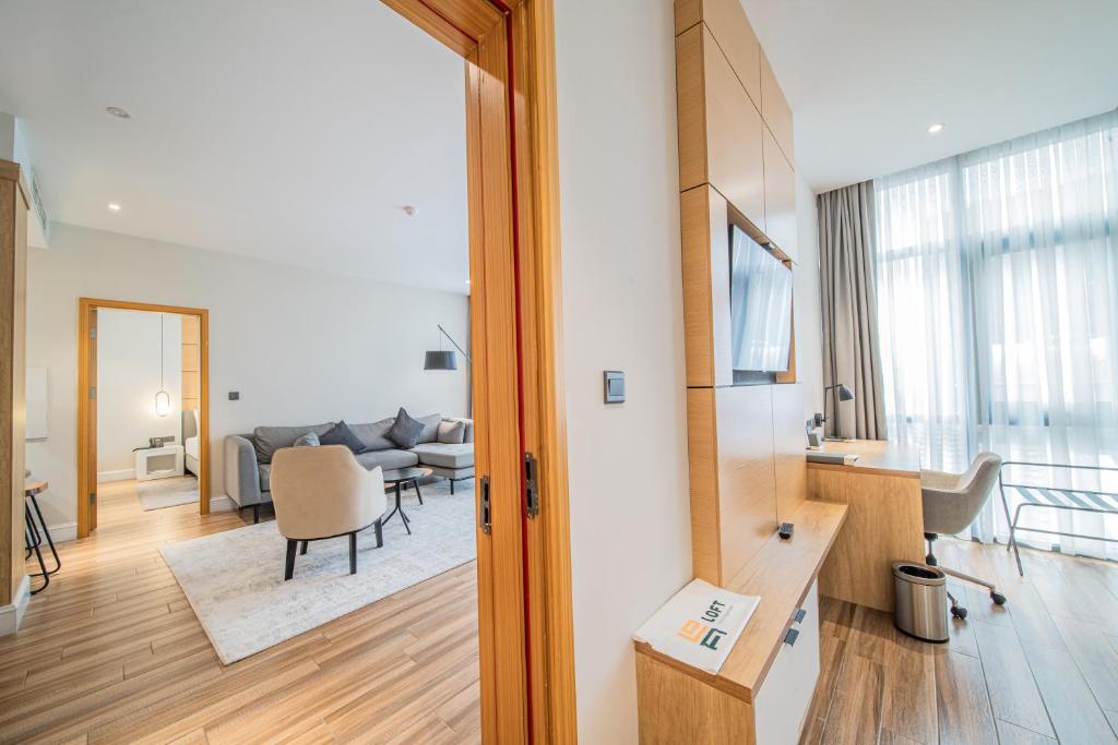 a living room with a couch and a table at Loft Hotel Apartment in Addis Ababa