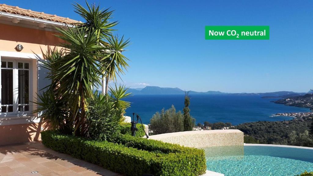 a villa with a view of the ocean at Die Drei Grazien, luxuriöse Villa mit eigenem Pool in Katouna
