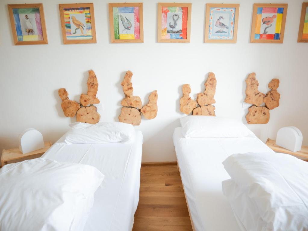 Postel nebo postele na pokoji v ubytování Ostello Bello Assisi Bevagna