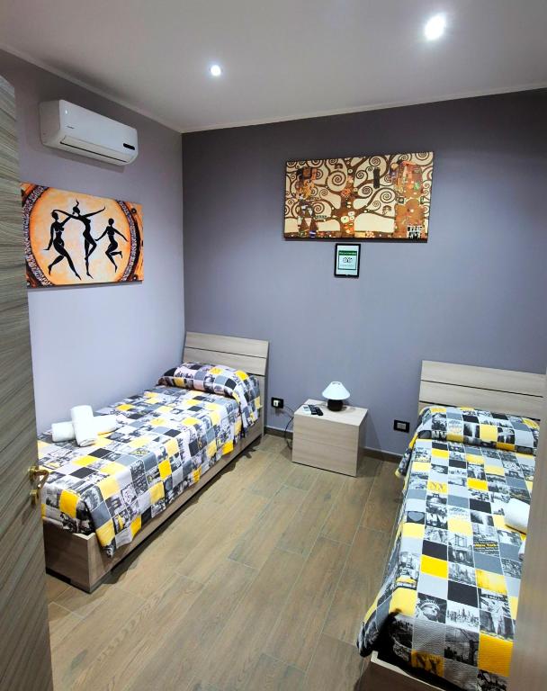 Łóżko lub łóżka w pokoju w obiekcie B&B Rampante