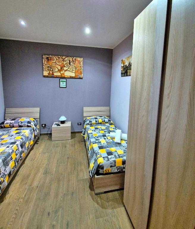 Łóżko lub łóżka w pokoju w obiekcie B&B Rampante
