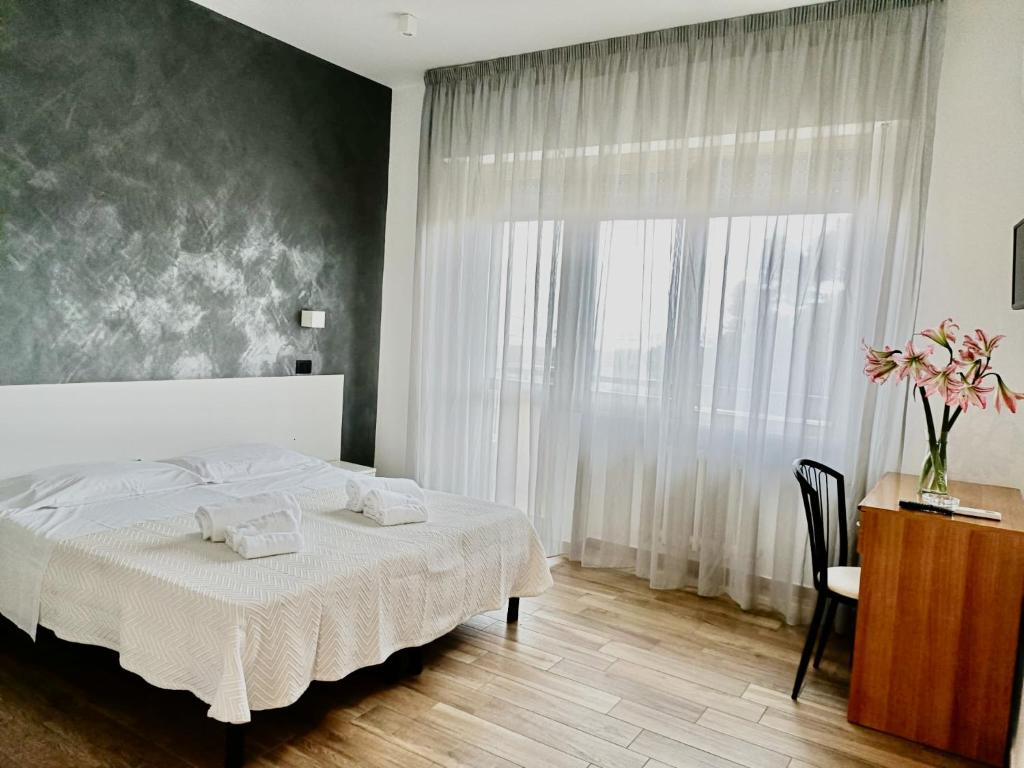 Postel nebo postele na pokoji v ubytování Hotel Il Moro