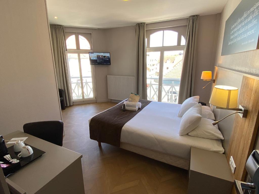 Postel nebo postele na pokoji v ubytování Hôtel Villa Des 2 Caps