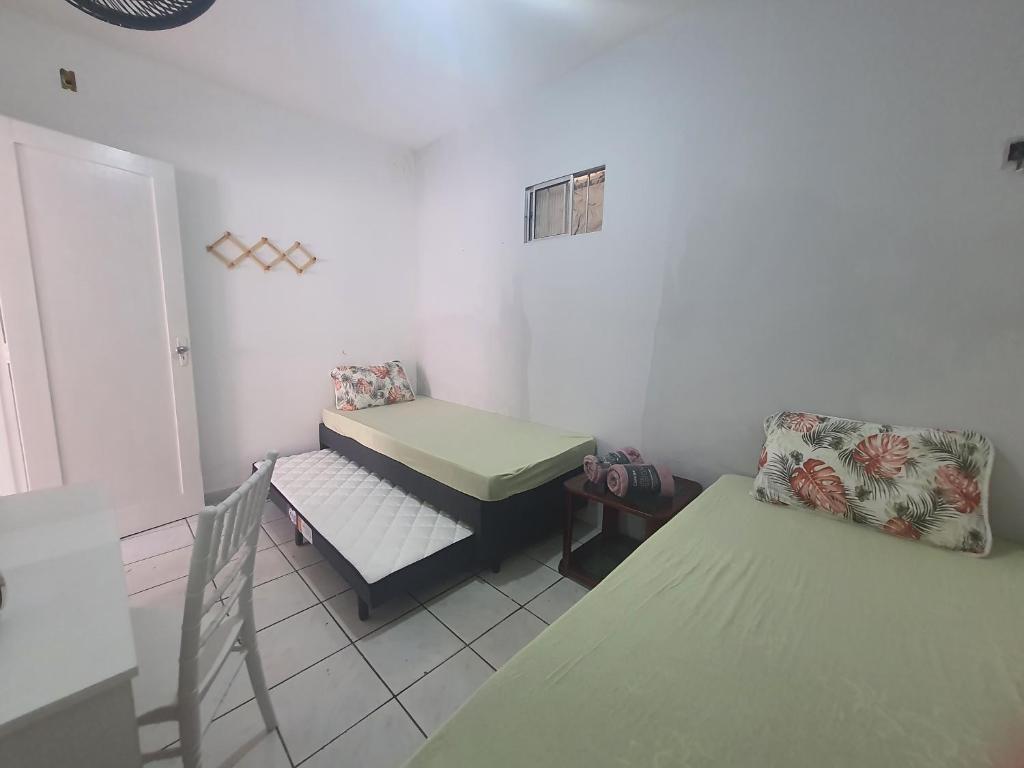 Giường trong phòng chung tại Casa de Campina