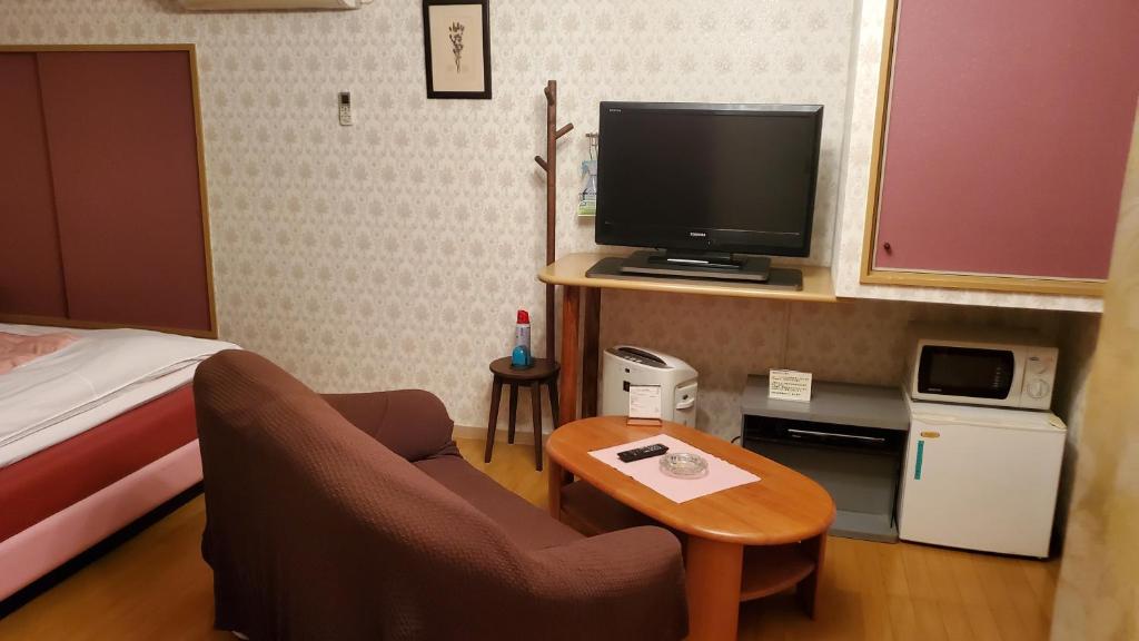 TV a/nebo společenská místnost v ubytování ホテル夢の里