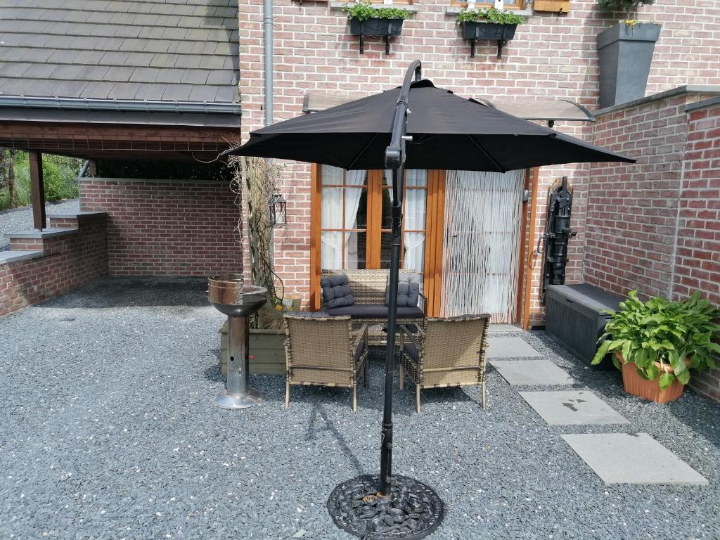 Patio nebo venkovní prostory v ubytování Au Coin Fleuri