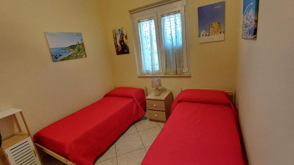 Postel nebo postele na pokoji v ubytování Villino Fatima