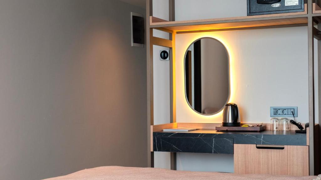 A bed or beds in a room at Kleopatra Dreams Beach Hotel