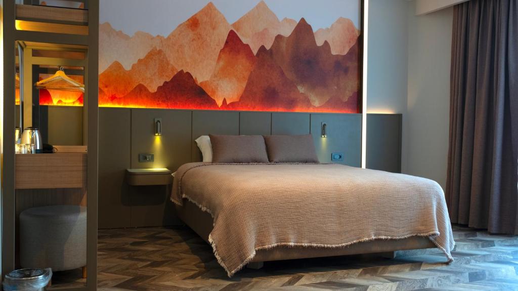 A bed or beds in a room at Kleopatra Dreams Beach Hotel