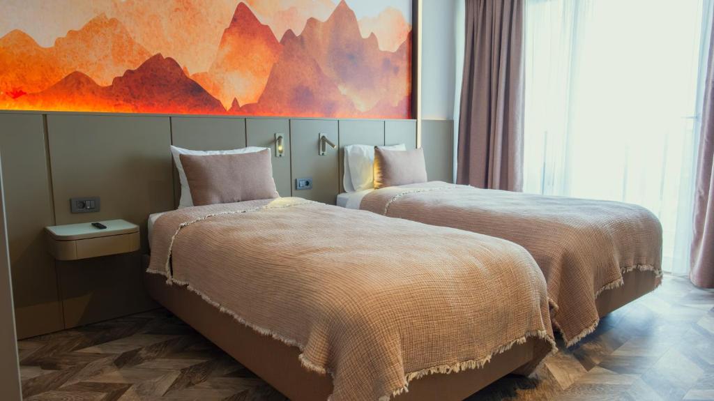 A bed or beds in a room at Kleopatra Dreams Beach Hotel