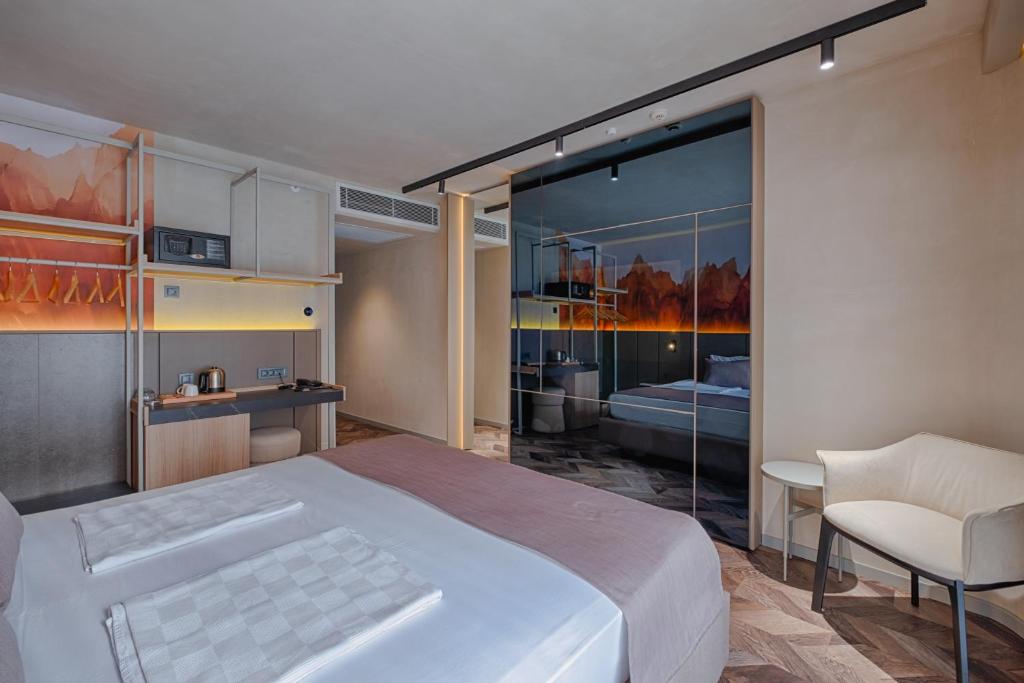 A bed or beds in a room at Kleopatra Dreams Beach Hotel