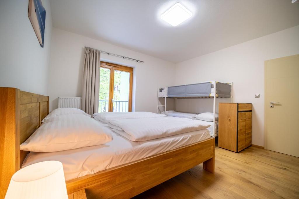 Postel nebo postele na pokoji v ubytování Lipno Port Apartment C203 - Lipno Home