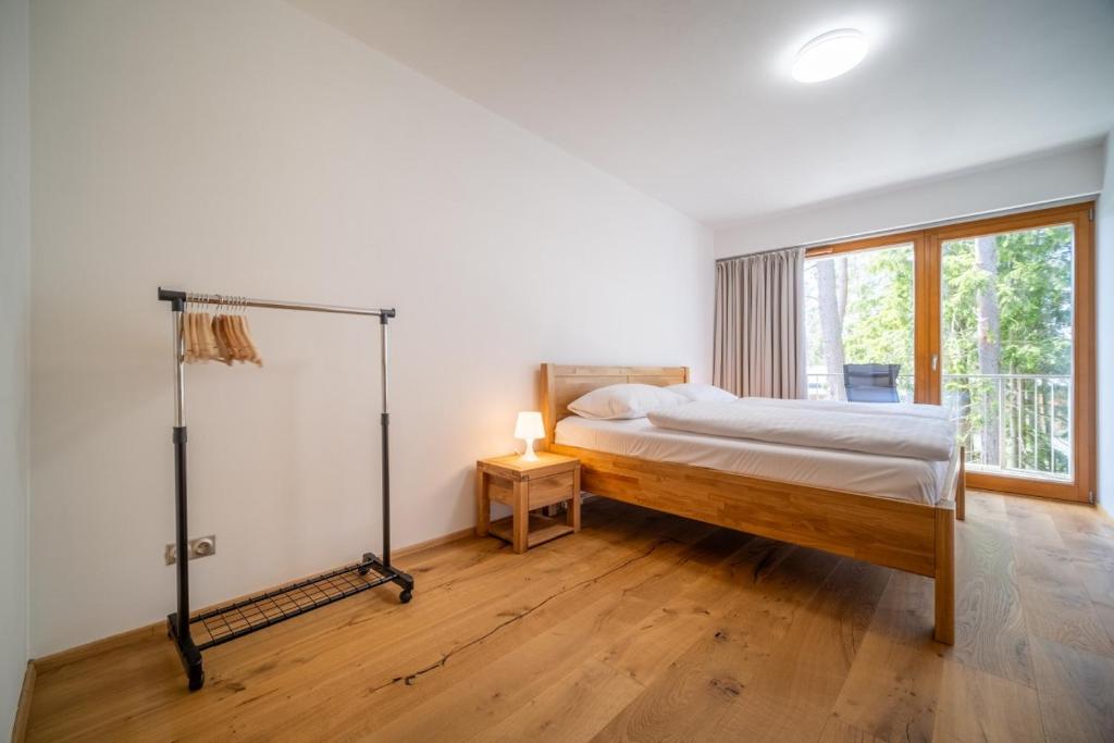 Postel nebo postele na pokoji v ubytování Lipno Port Apartment C203 - Lipno Home