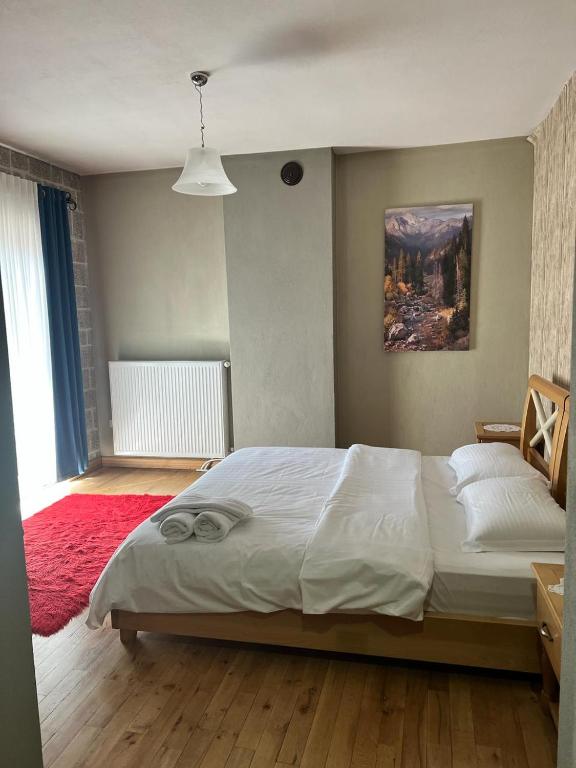 Postel nebo postele na pokoji v ubytování Hotel Bacelli Voskopoje