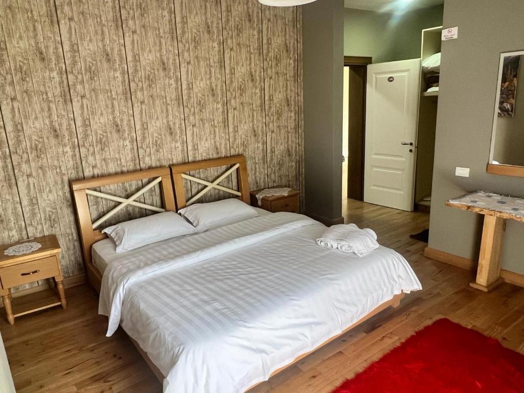 Postel nebo postele na pokoji v ubytování Hotel Bacelli Voskopoje