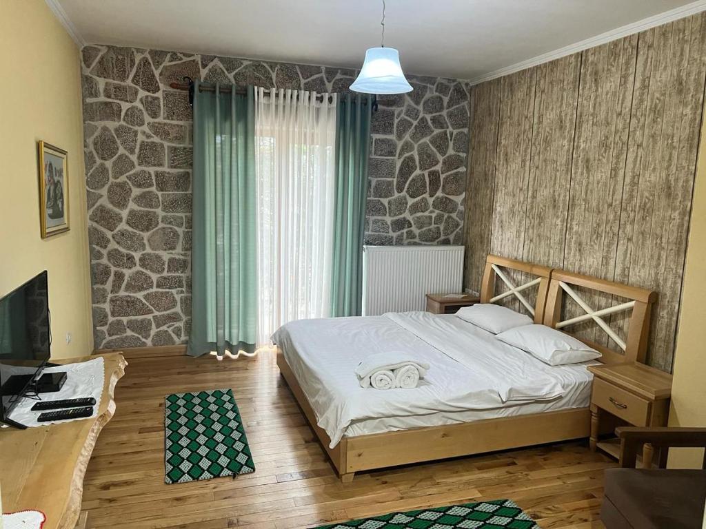 Postel nebo postele na pokoji v ubytování Hotel Bacelli Voskopoje