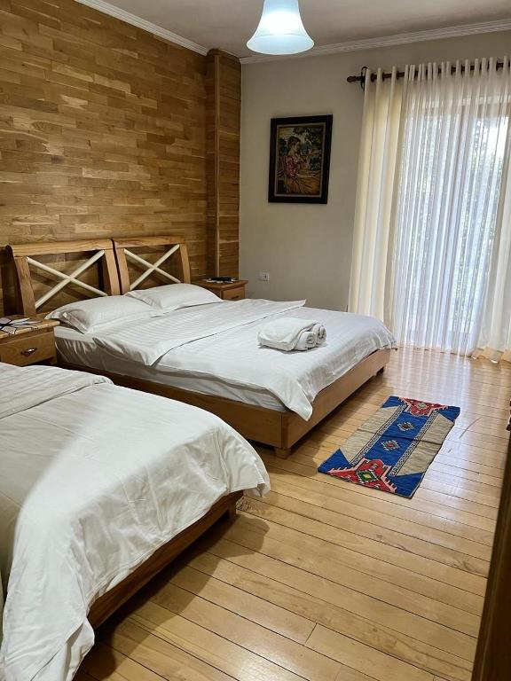 Postel nebo postele na pokoji v ubytování Hotel Bacelli Voskopoje