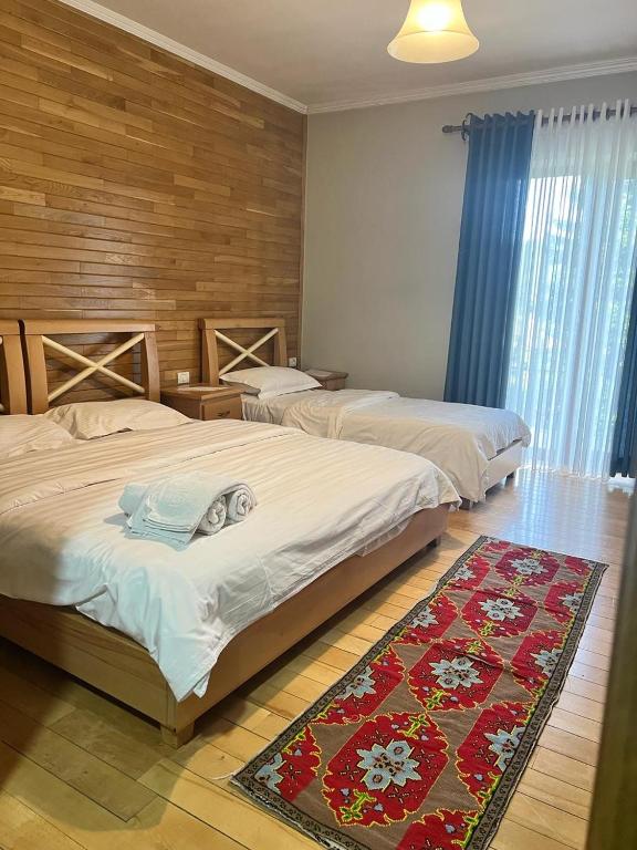 Postel nebo postele na pokoji v ubytování Hotel Bacelli Voskopoje