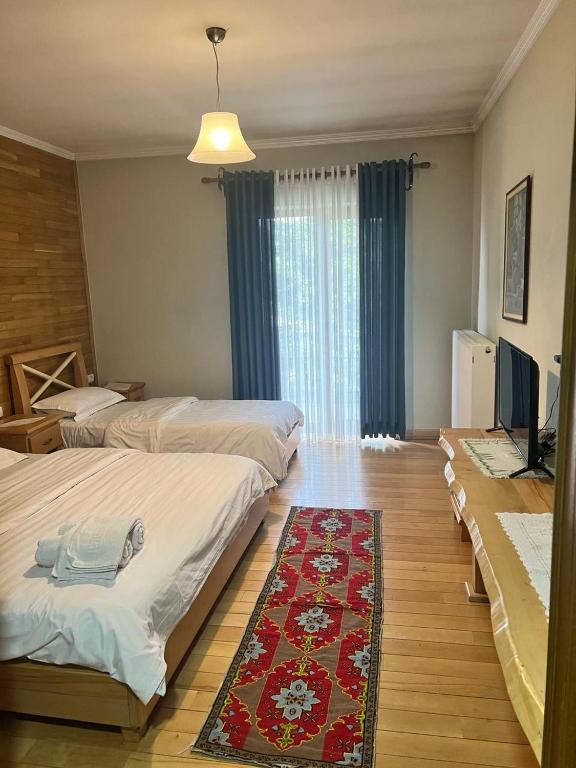 Postel nebo postele na pokoji v ubytování Hotel Bacelli Voskopoje