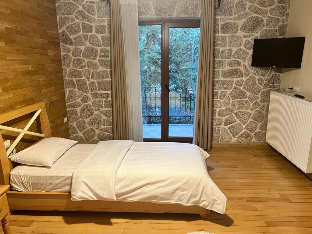 Postel nebo postele na pokoji v ubytování Hotel Bacelli Voskopoje