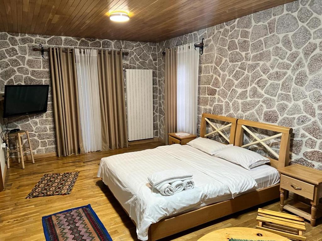 Postel nebo postele na pokoji v ubytování Hotel Bacelli Voskopoje