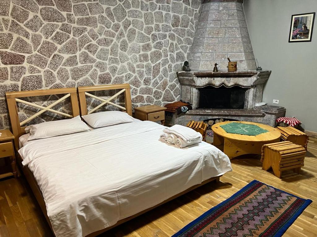 Postel nebo postele na pokoji v ubytování Hotel Bacelli Voskopoje