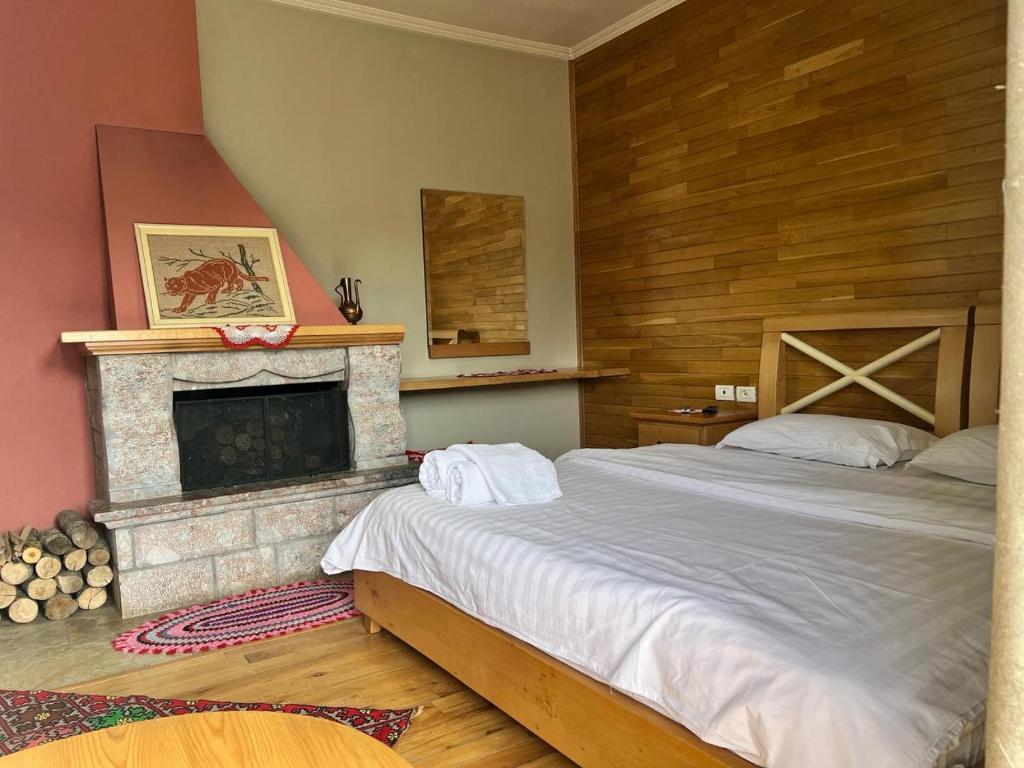 Postel nebo postele na pokoji v ubytování Hotel Bacelli Voskopoje
