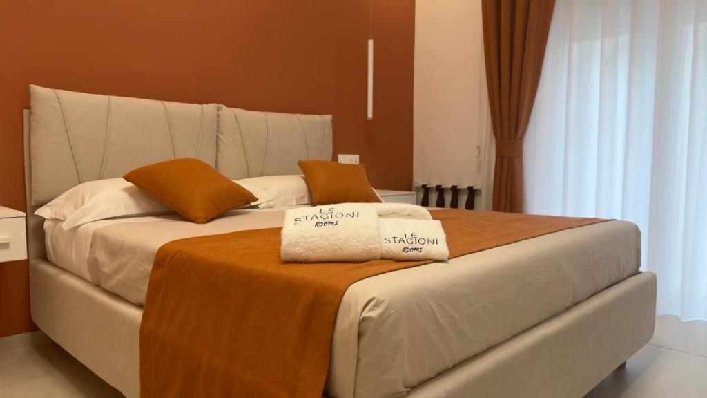 Postel nebo postele na pokoji v ubytování Le Stagioni Rooms