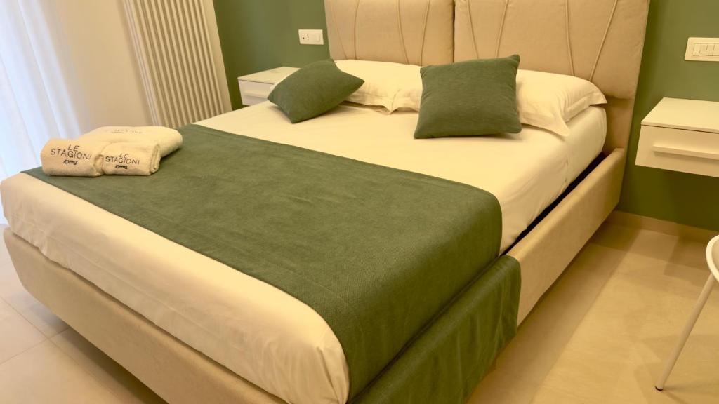 Postel nebo postele na pokoji v ubytování Le Stagioni Rooms