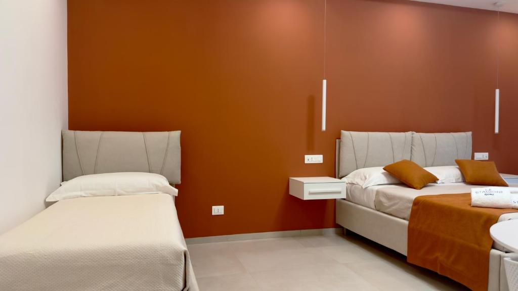 Postel nebo postele na pokoji v ubytování Le Stagioni Rooms