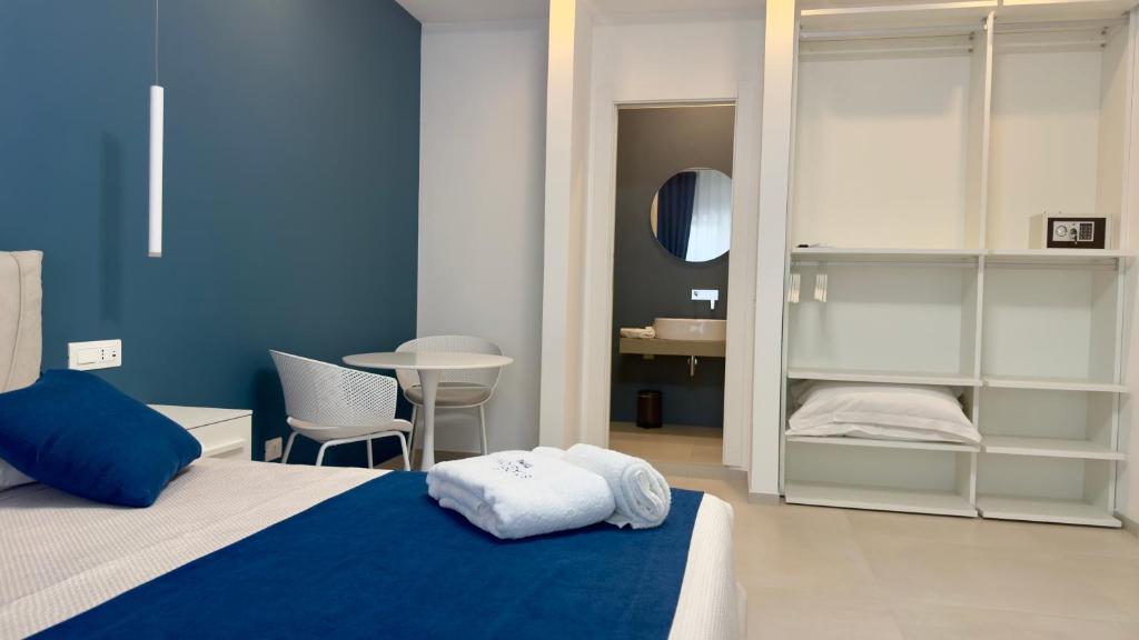 Postel nebo postele na pokoji v ubytování Le Stagioni Rooms