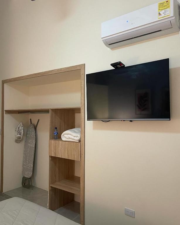 TV a/nebo společenská místnost v ubytování Cal Bed & Breakfast Ibague