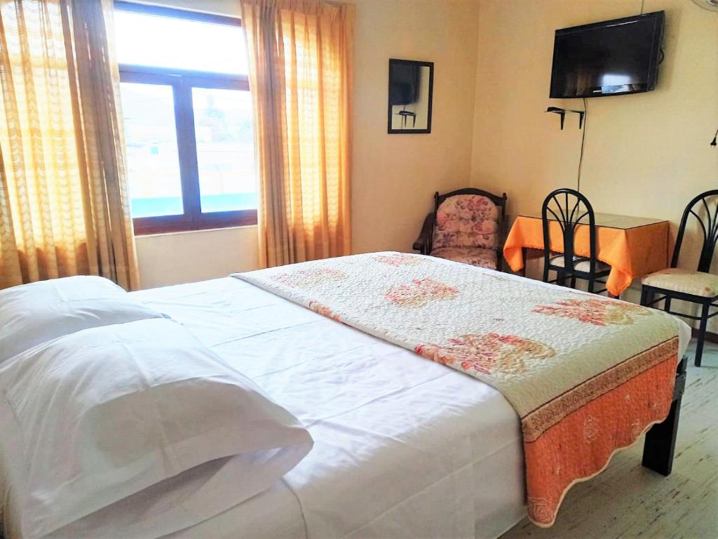 Postel nebo postele na pokoji v ubytování Anccalla Inn Guesthouse