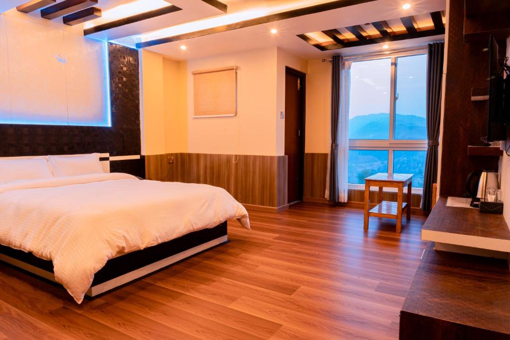 Ένα ή περισσότερα κρεβάτια σε δωμάτιο στο Pine Tree Resort