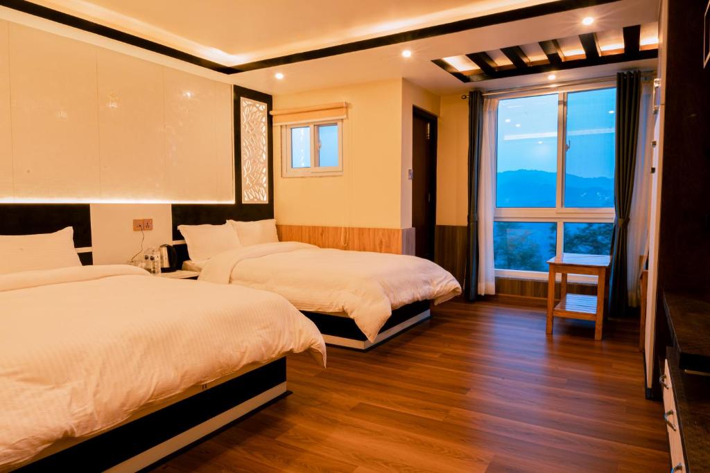 Ένα ή περισσότερα κρεβάτια σε δωμάτιο στο Pine Tree Resort