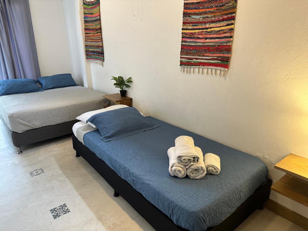 Postel nebo postele na pokoji v ubytování Hotel Casa Lucca