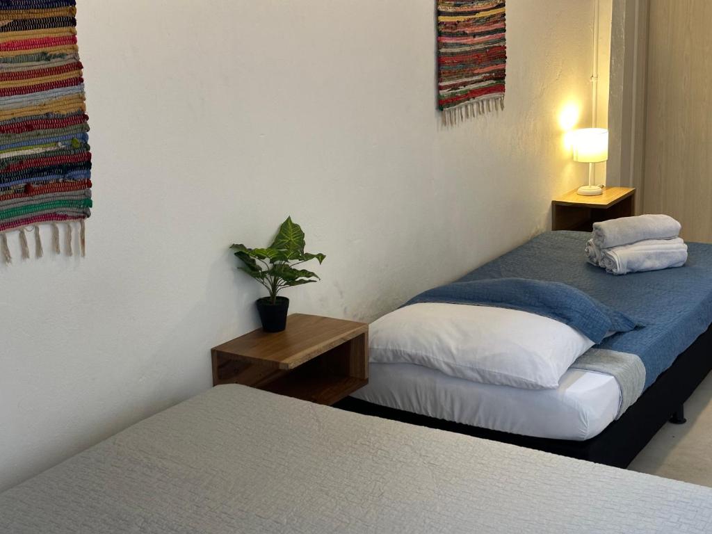 Postel nebo postele na pokoji v ubytování Hotel Casa Lucca