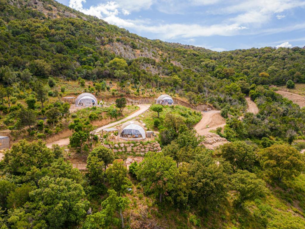 an aerial view of a house in a mountain at Domaine de Sonia - Logements éco-insolites in Porto-Vecchio