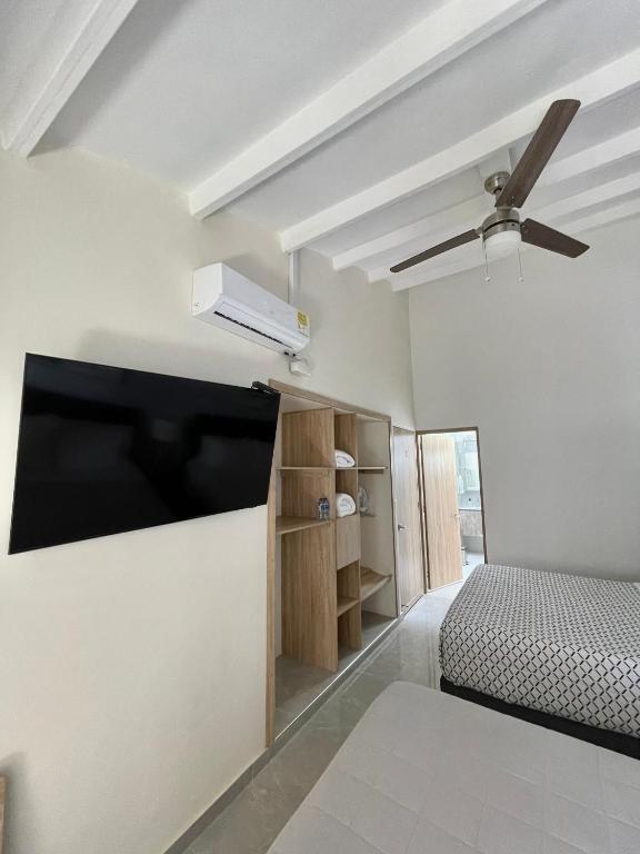 Postel nebo postele na pokoji v ubytování Cal Bed & Breakfast Ibague