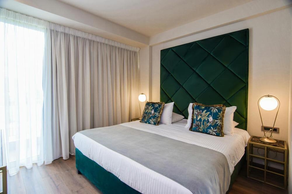 Postel nebo postele na pokoji v ubytování Golden Rooms