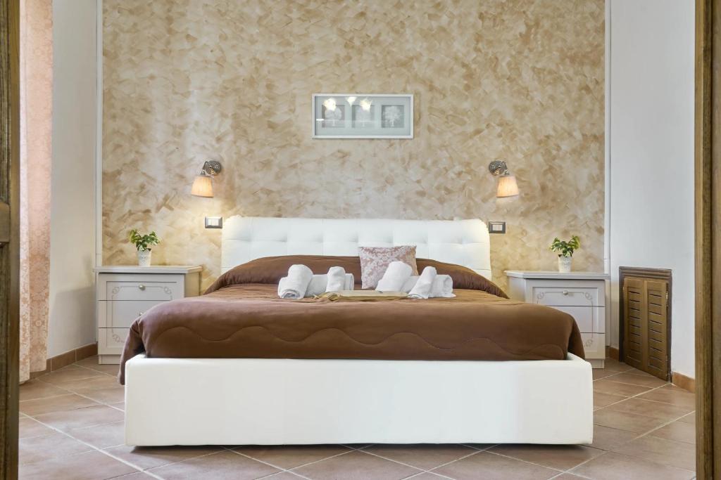 Postel nebo postele na pokoji v ubytování Resort Umbria Spa