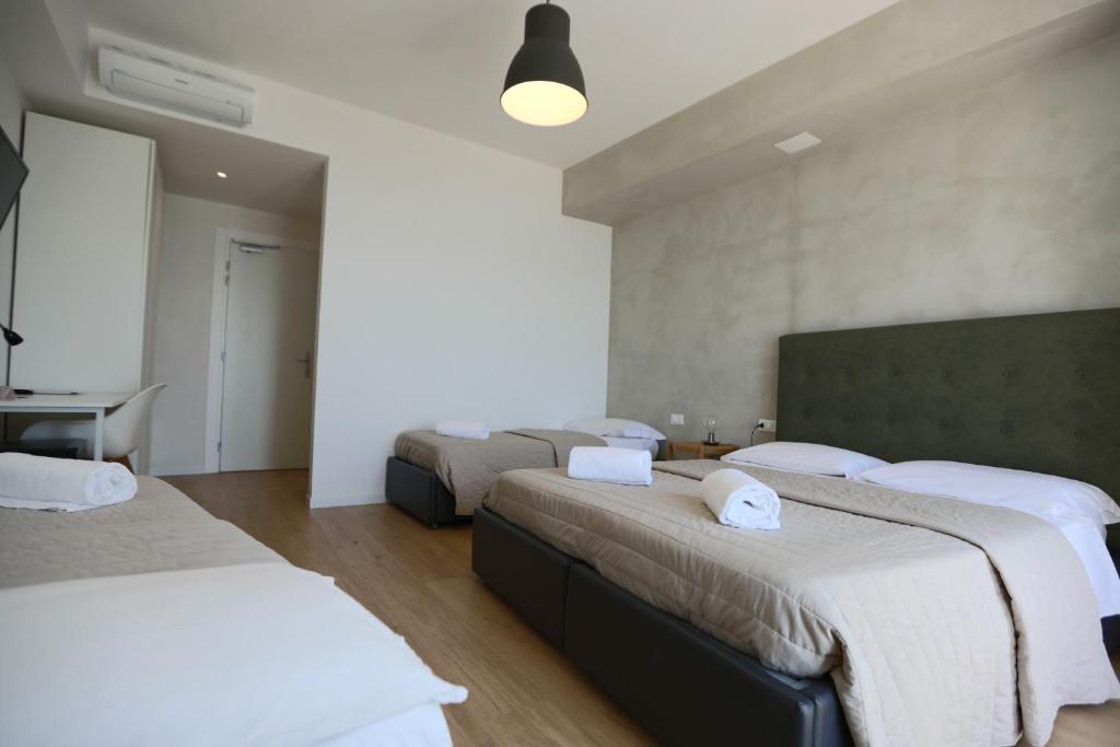 Postel nebo postele na pokoji v ubytování Hotel Concordia