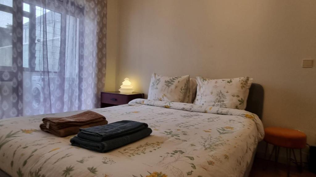 Katil atau katil-katil dalam bilik di Cozy Apartment Casa da Música