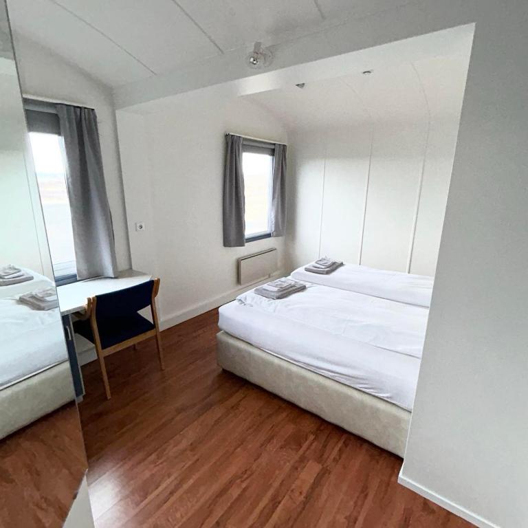 Postel nebo postele na pokoji v ubytování Guesthouse Svartiskógur Egilsstaðir