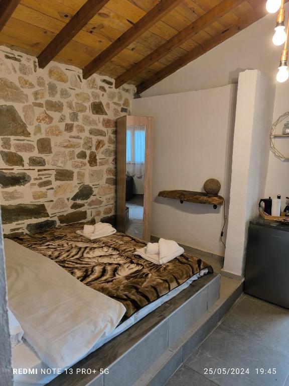 Postel nebo postele na pokoji v ubytování Mountain House Paliouras
