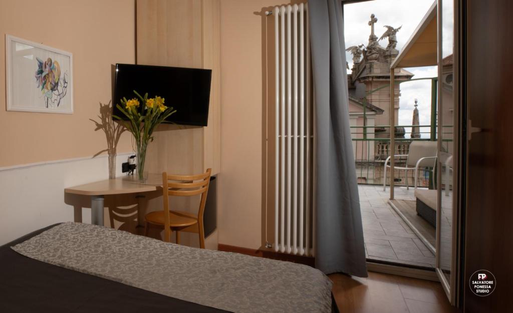 TV a/nebo společenská místnost v ubytování Hotel Vista Lago