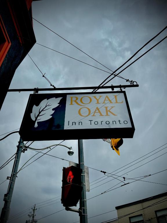 a sign for arwaan oak innoit at Royal Oak Inn in Toronto