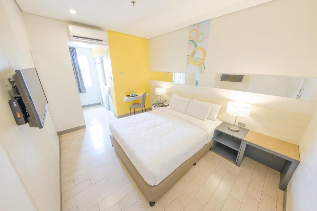 Postel nebo postele na pokoji v ubytování Go Hotels Lanang - Davao