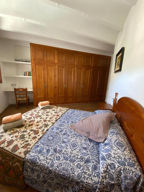 Postel nebo postele na pokoji v ubytování Cal Cutxó - Nou balneari rural per la família