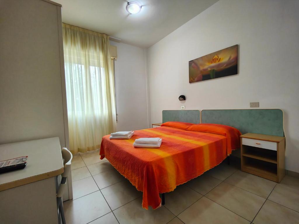 Postel nebo postele na pokoji v ubytování Hotel Ben Hur